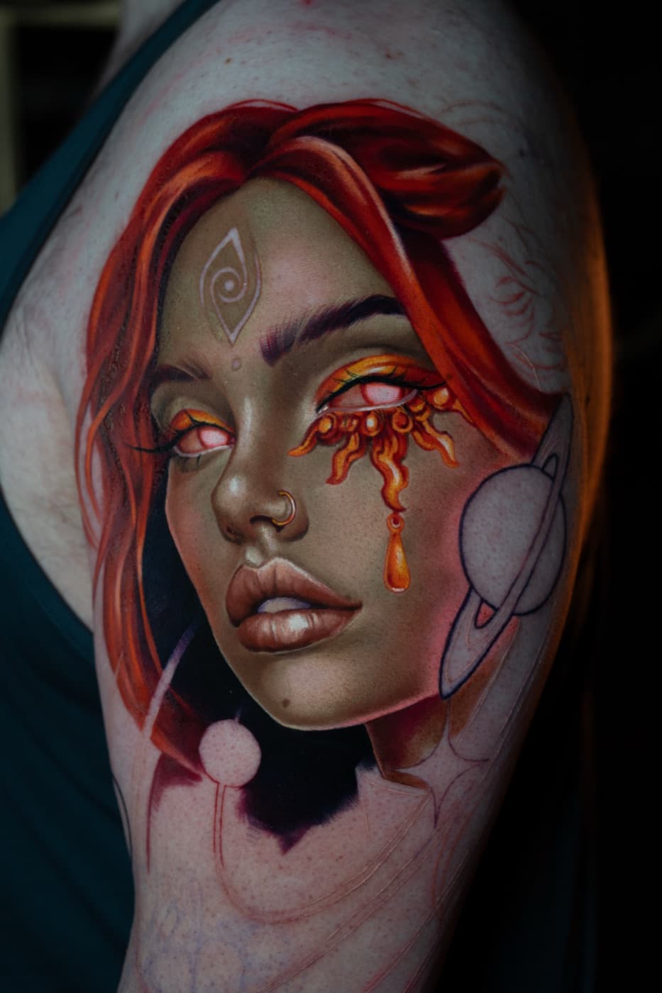 Colour portrait tattoo of a woman with a cosmic teardrop eye